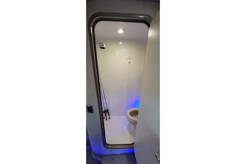 Slide: The Image of Interior view of 2005 Formula 48 Yacht bathroom with modern fixtures and blue lighting. - 47