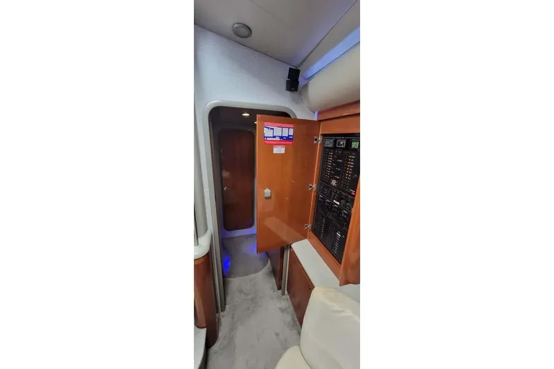 Slide: The Image of Interior of 2005 Formula 48 Yacht with control panel and wooden cabinetry. - 50