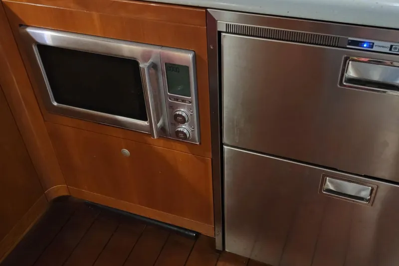 Slide: The Image of Microwave and stainless steel appliances in 2005 Formula 48 Yacht kitchen. - 55