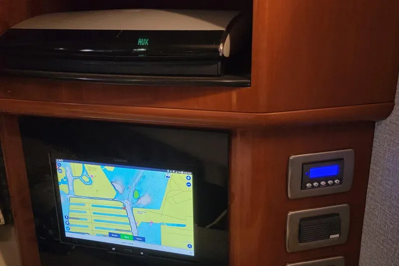 Slide: The Image of Interior of 2005 Formula 48 Yacht with navigation system and control panel. - 56