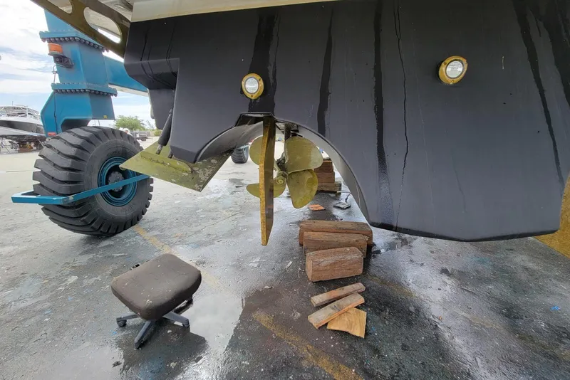 Slide: The Image of 2005 Formula 48 Yacht under maintenance, showing propeller and hull details. - 59