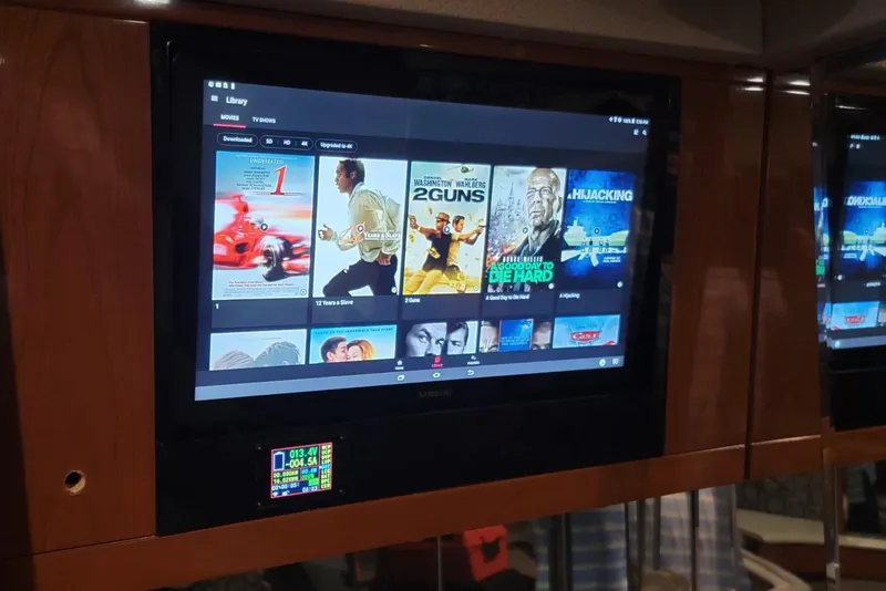 Slide: The Image of Entertainment system on 2005 Formula 48 Yacht displaying movie library. - 62