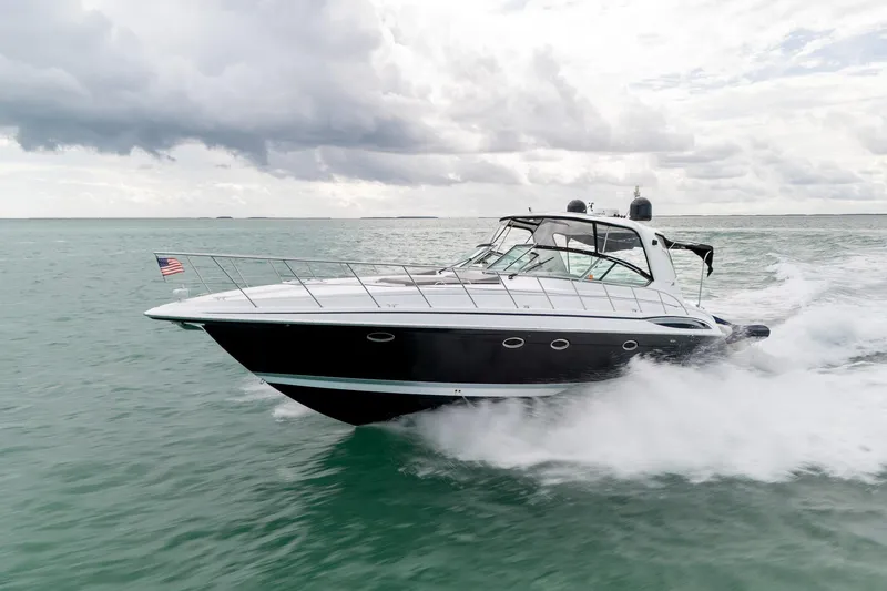 Slide: The Image of 2005 Formula 48 Yacht cruising on open water under cloudy skies. - 8