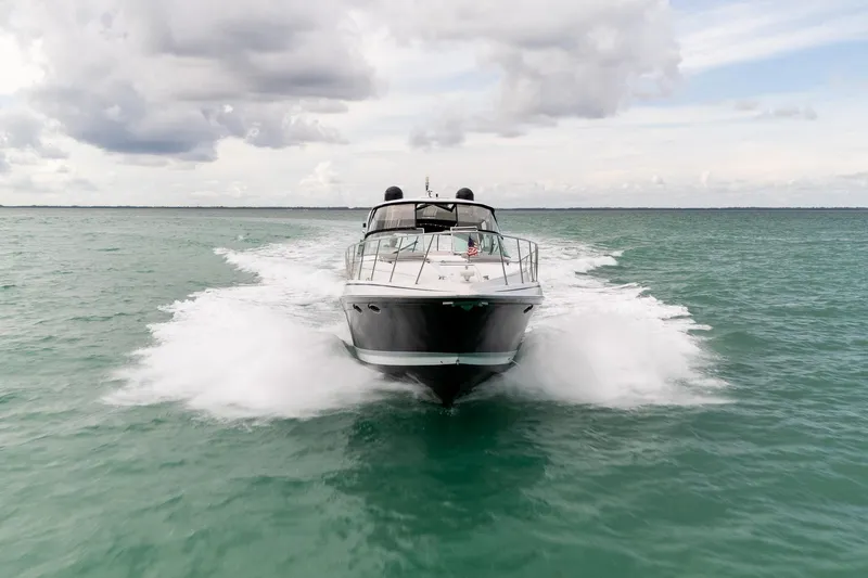 Slide: The Image of 2005 Formula 48 Yacht cruising on open water under cloudy skies. - 9