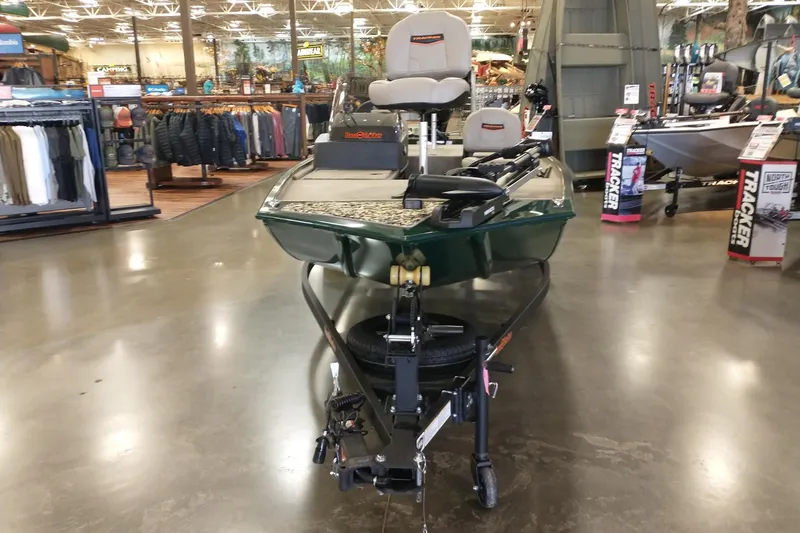 Slide: The Image of 2026 Tracker Bass Tracker Classic Limited boat displayed in a showroom. - 5