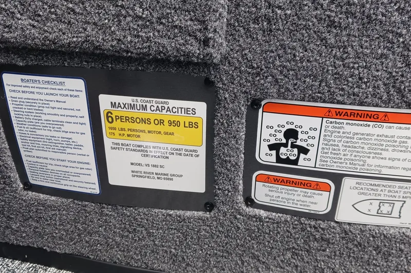 Slide: The Image of Safety labels on 2026 Ranger VS1882SC Reata boat, detailing capacity and warnings. - 8