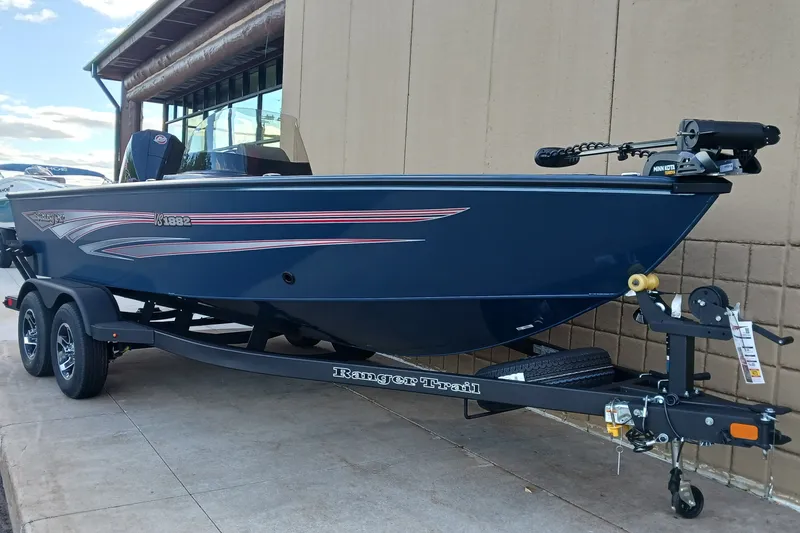 Slide: The Image of 2026 Ranger VS1882SC Reata boat on trailer, blue exterior, parked outdoors. - 1