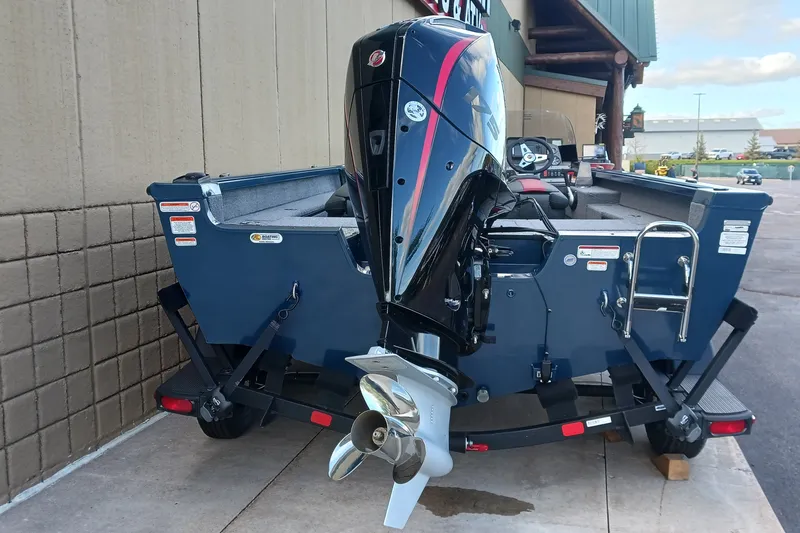 Slide: The Image of 2026 Ranger VS1882SC Reata boat with powerful outboard motor, parked outdoors. - 3
