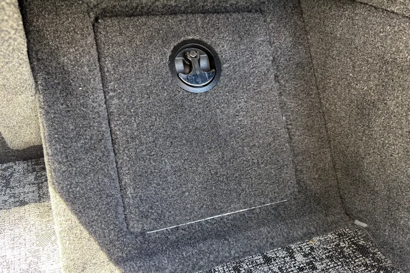 Slide: The Image of Carpeted storage compartment in 2026 Tracker Pro Guide V-16 WT boat. - 35