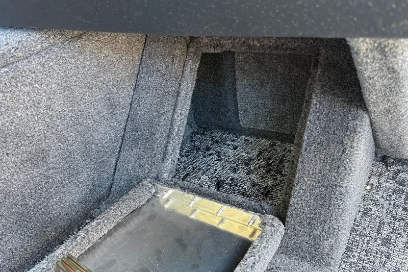 Slide: The Image of Carpeted interior compartment of 2026 Tracker Pro Guide V-16 WT boat. - 29