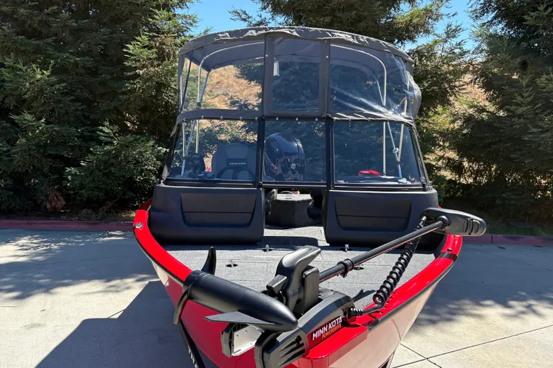 Slide: The Image of 2026 Tracker Pro Guide V-16 WT boat with canopy and Minn Kota trolling motor. - 15