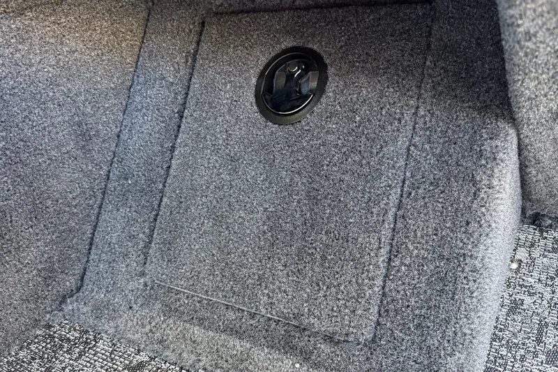 Slide: The Image of Carpeted storage compartment in 2026 Tracker Pro Guide V-16 WT boat. - 37
