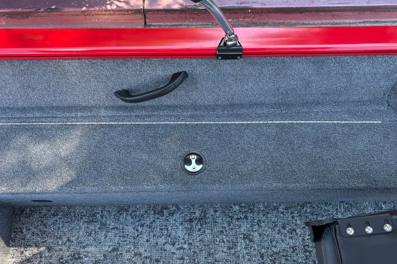 Slide: The Image of 2026 Tracker Pro Guide V-16 WT boat interior with red trim and carpeted flooring. - 34