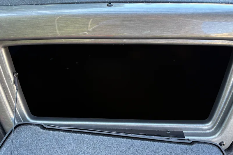 Slide: The Image of 2026 Tracker Pro Guide V-16 WT storage compartment with sleek metallic finish. - 22