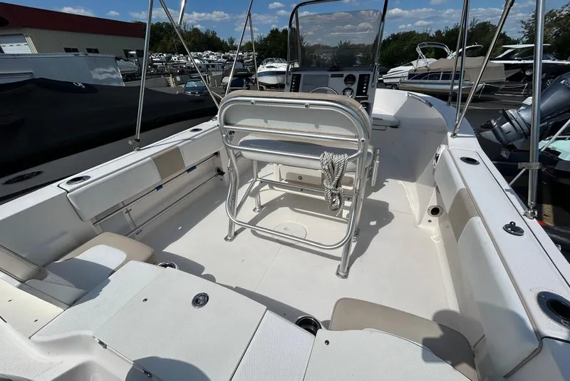 Slide: The Image of 2020 Robalo R180 Center Console boat interior with seating and console view. - 4