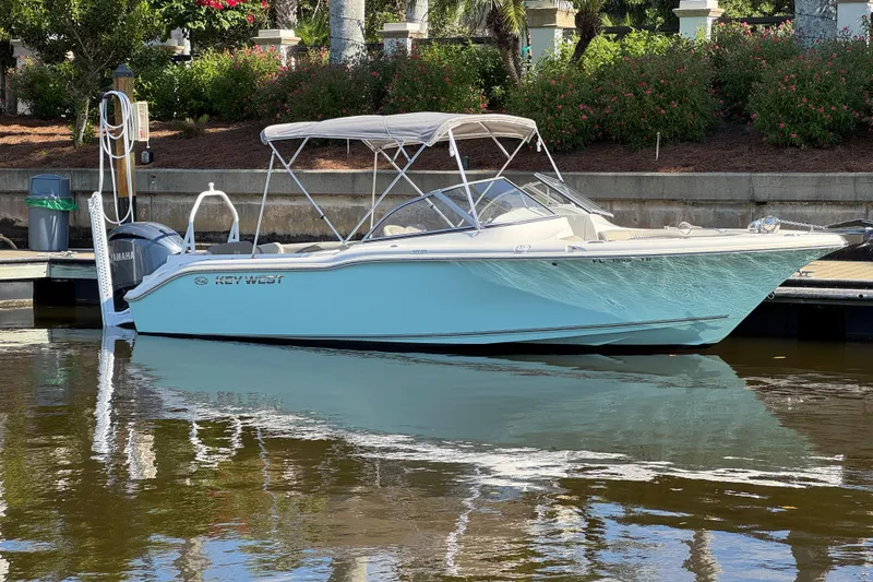 The Image of 2022 Key West 239 DFS boat docked, featuring sleek design and Yamaha engine. - 0