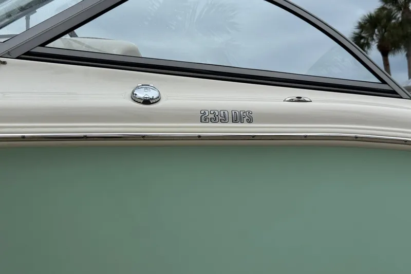 Slide: The Image of 2022 Key West 239 DFS boat side view with model name visible. - 13