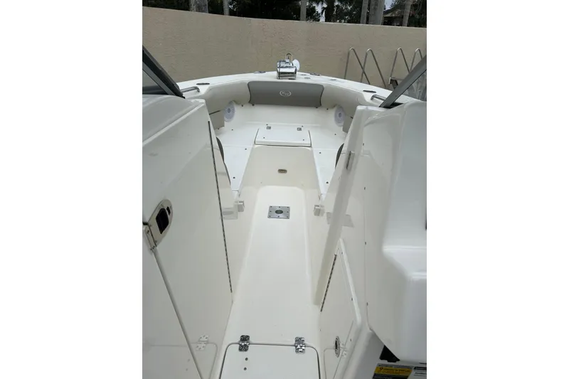 Slide: The Image of 2022 Key West 239 DFS boat interior with open deck and storage compartments. - 18
