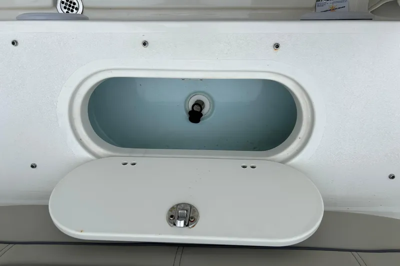 Slide: The Image of Livewell compartment on a 2022 Key West 239 DFS boat, open and empty. - 20