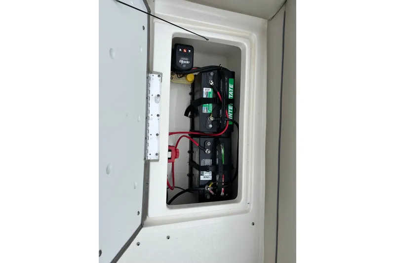 Slide: The Image of Battery compartment of 2022 Key West 239 DFS boat with wiring and components. - 25