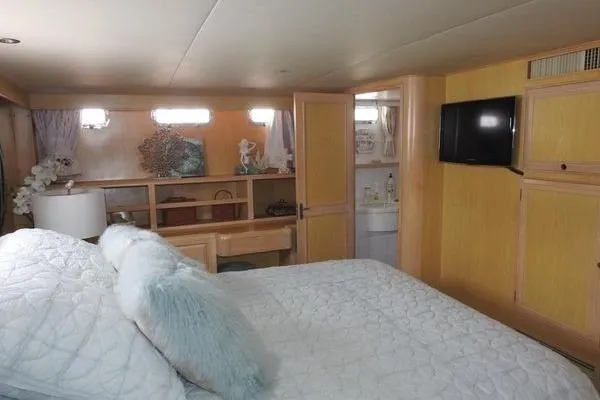 Slide: The Image of Luxurious bedroom in 1998 Ocean Alexander Yachtfish Command Bridge with cozy decor and modern amenities. - 11