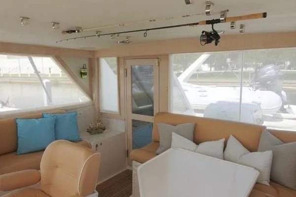 Slide: The Image of Interior of 1998 Ocean Alexander Yachtfish Command Bridge with seating and fishing rod. - 19