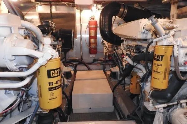 Slide: The Image of Engine room of 1998 Ocean Alexander Yachtfish Command Bridge with CAT filters and fire extinguisher. - 27
