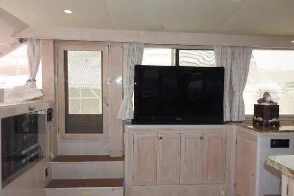 Slide: The Image of Interior of 1998 Ocean Alexander Yachtfish Command Bridge with TV and cabinetry. - 5