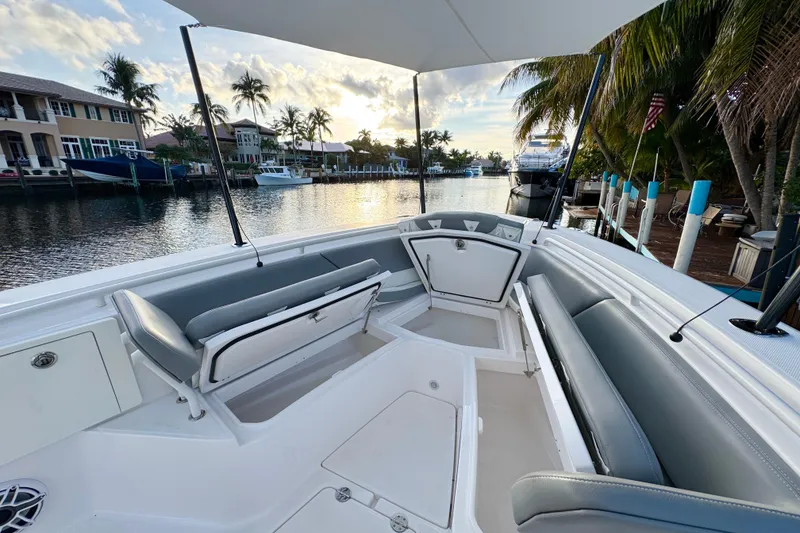 Slide: The Image of 2021 Everglades 335 Center Console boat interior with open door and compact sink area. - 23