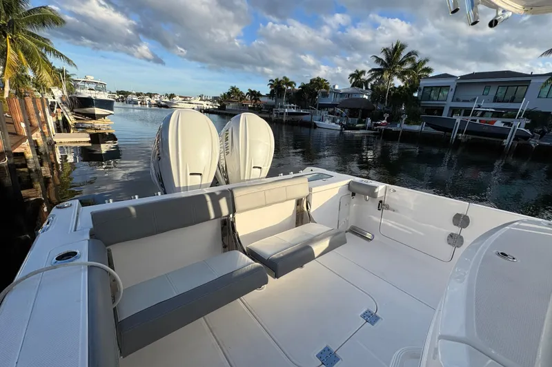 Slide: The Image of Overhead view of 2021 Everglades 335 Center Console boat with canopy on water. - 3
