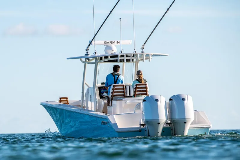 Slide: The Image of Manufacturer Provided Image: 2026 Jupiter 32 boat with dual engines cruising on open water. - 3