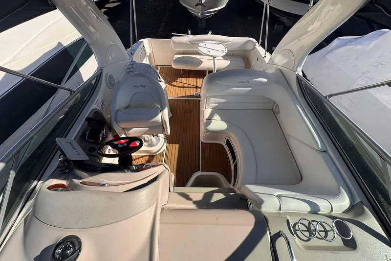 Slide: The Image of 2007 Sea Ray 280 Sundancer boat interior with seating and helm. - 13