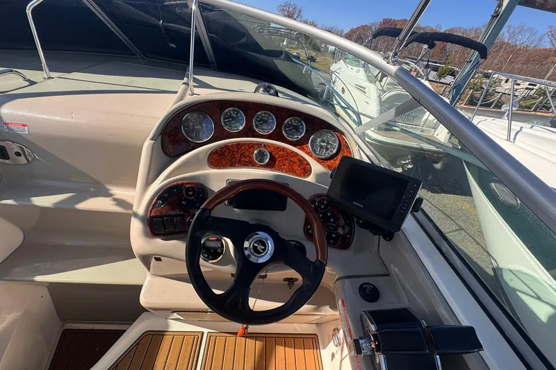 Slide: The Image of 2007 Sea Ray 280 Sundancer helm with gauges and navigation system. - 9