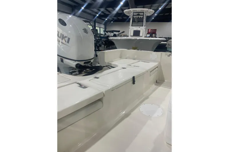 Slide: The Image of 2026 Bulls Bay 2200 XS boat interior with Suzuki engine in showroom. - 11
