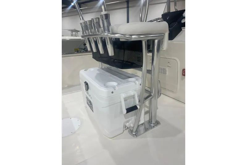 Slide: The Image of 2026 Bulls Bay 2200 XS boat with cooler and rod holders on deck. - 12