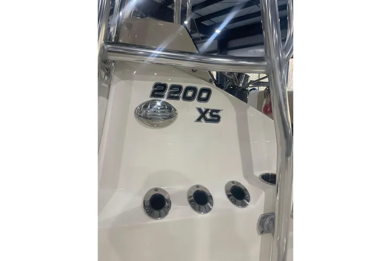 Slide: The Image of 2026 Bulls Bay 2200 XS boat with sleek design and chrome accents. - 2