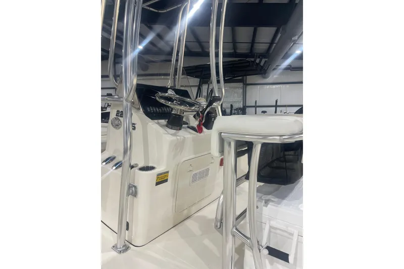 Slide: The Image of 2026 Bulls Bay 2200 XS boat interior with steering console and seating. - 5