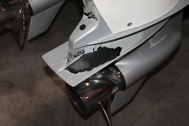 Slide: The Image of Close-up of a 2017 Boston Whaler 330 Outrage boat propeller and lower unit. - 12