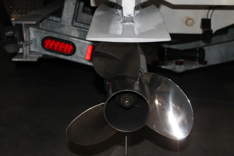 Slide: The Image of Propeller of 2017 Boston Whaler 330 Outrage boat on trailer. - 13