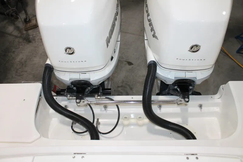 Slide: The Image of Twin Mercury FourStroke engines on a 2017 Boston Whaler 330 Outrage boat. - 18