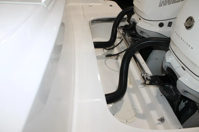 Slide: The Image of 2017 Boston Whaler 330 Outrage boat engine compartment with Mercury FourStroke engines. - 19