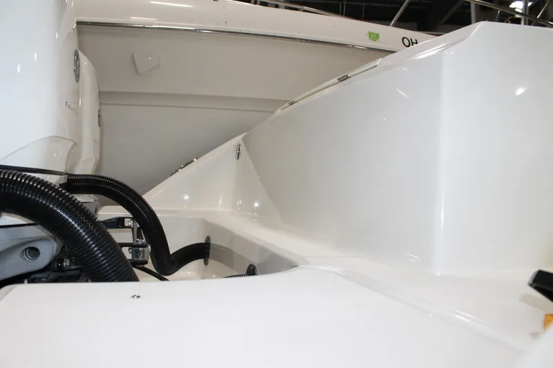 Slide: The Image of 2017 Boston Whaler 330 Outrage boat interior, showcasing sleek design and engine components. - 20