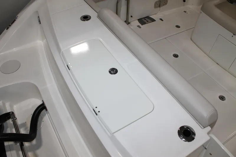 Slide: The Image of 2017 Boston Whaler 330 Outrage boat interior with seating and storage compartments. - 22