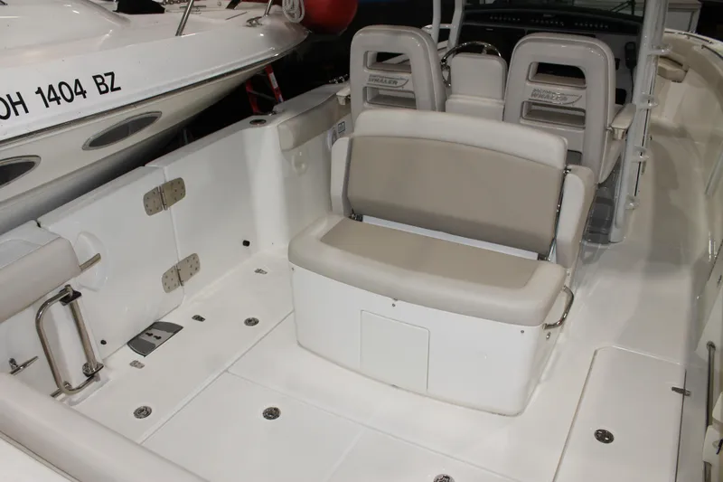 Slide: The Image of 2017 Boston Whaler 330 Outrage boat interior with seating and helm. - 24
