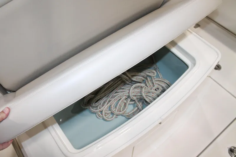Slide: The Image of Storage compartment with rope on a 2017 Boston Whaler 330 Outrage boat. - 26