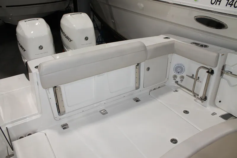 Slide: The Image of 2017 Boston Whaler 330 Outrage boat interior with dual Mercury engines. - 28
