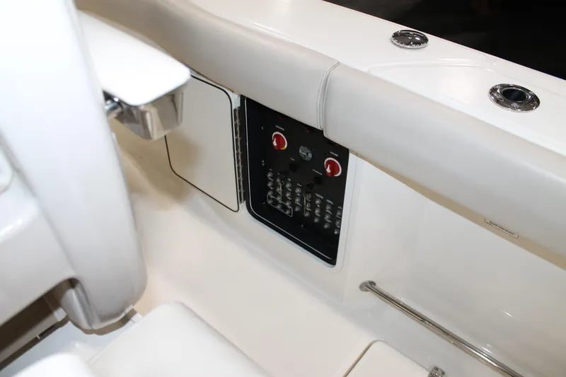 Slide: The Image of 2017 Boston Whaler 330 Outrage boat interior with control panel and seating. - 35