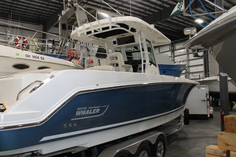 Slide: The Image of 2017 Boston Whaler 330 Outrage boat in indoor storage facility. - 4