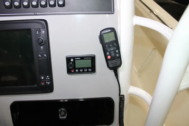 Slide: The Image of Control panel of a 2017 Boston Whaler 330 Outrage with navigation and communication devices. - 42