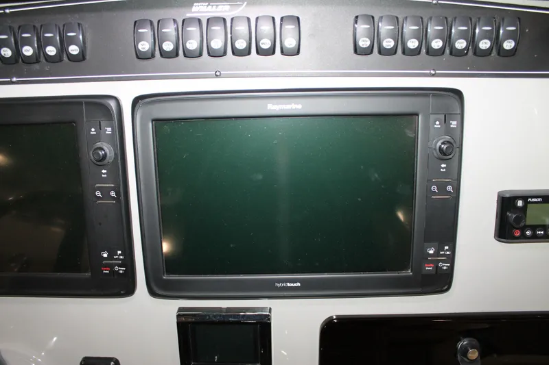 Slide: The Image of Control panel of a 2017 Boston Whaler 330 Outrage with Raymarine displays. - 43